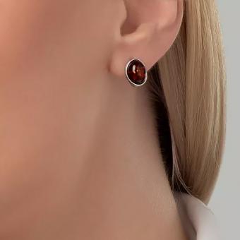 Earrings in 925 sterling silver with oval red amber